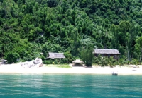 Cham island- full of white sand, trees and clouds